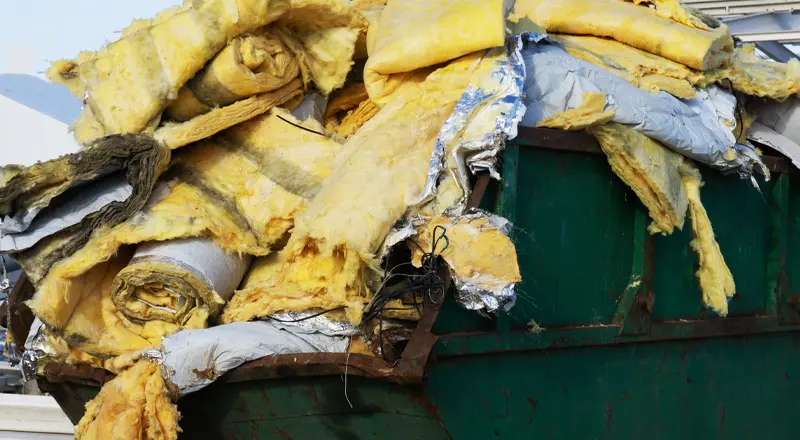 Old Insulation Pile in Dumpster: Understanding the Benefits of Attic Insulation